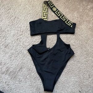 Versace Greca Border one-piece swimsuit with a gold-accented one-shoulder strap